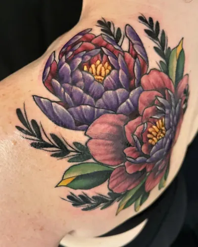 Neo-traditional purple and pink peony cluster on a shoulder — by Adam Crane at Ministry Ink