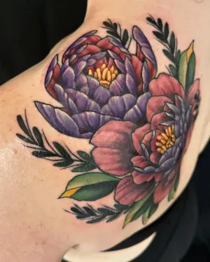 Neo-traditional purple and pink peony cluster on a shoulder — by Adam Crane