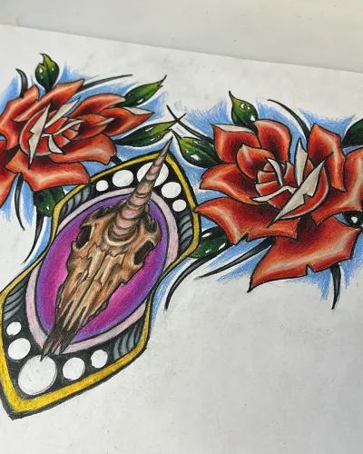 Neo-traditional flash of two red roses framing an ornate gold locket — by Adam Crane at Ministry Ink