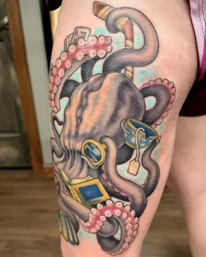 Colour octopus clutching cut gemstones, tattooed on a thigh — by Adam Crane
