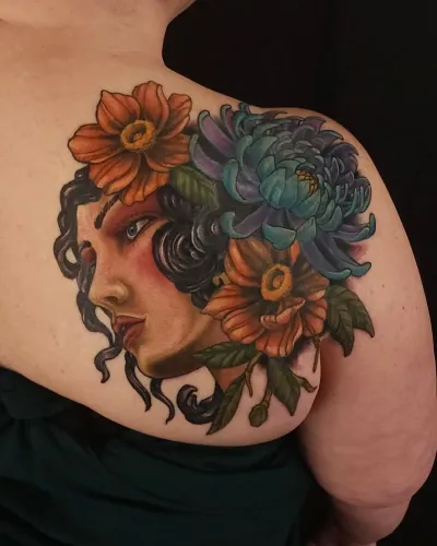 Neo-traditional portrait of a woman crowned with sunflowers, on a shoulder — by Adam Crane at Ministry Ink