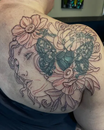 Fine line black and grey floral shoulder piece, freshly outlined — by Adam Crane at Ministry Ink