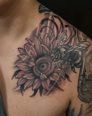 Black and grey sunflower and honeybee shoulder piece — by Adam Crane