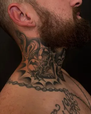 Black and grey ornamental neck and throat piece — by Chay Menke
