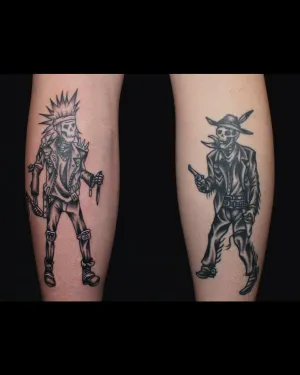 A matching pair of black and grey character tattoos, one on each calf — by Chay Menke