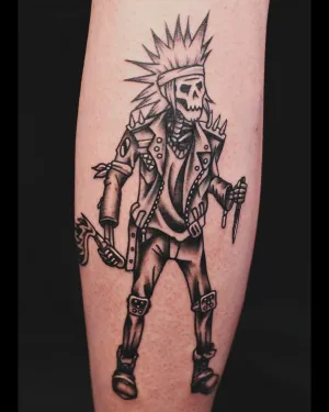 Black and grey punk skeleton figure striding, on a calf — by Chay Menke