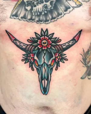 American traditional longhorn skull with flowers across a sternum — by Chay Menke