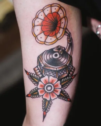 American traditional pocket watch and flowers on an arm — by Chay Menke at Ministry Ink