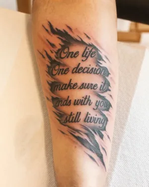 Fine line script reading One life, one decision, on an inner arm — by Chay Menke