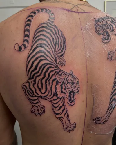 Black and grey tiger back piece, healed and settled — by Gabriel Gonzalez at Ministry Ink